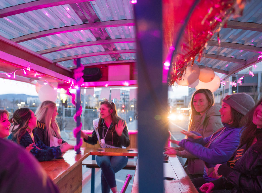 Brew Bike with Pink Bike decorations and passengers