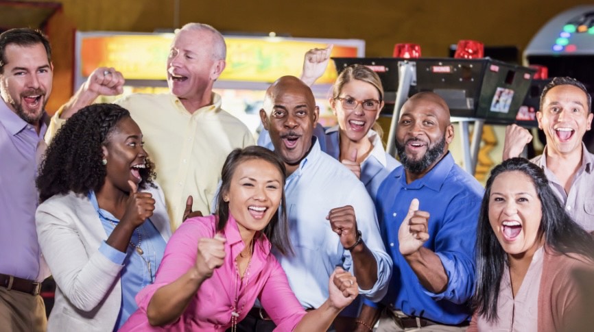 A group of people celebrating a workplace achievement